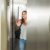 74267860_young-woman-in-elevator